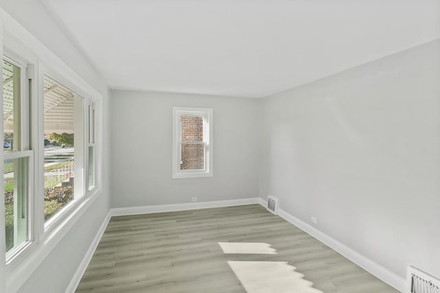 spare room with light hardwood / wood-style floors