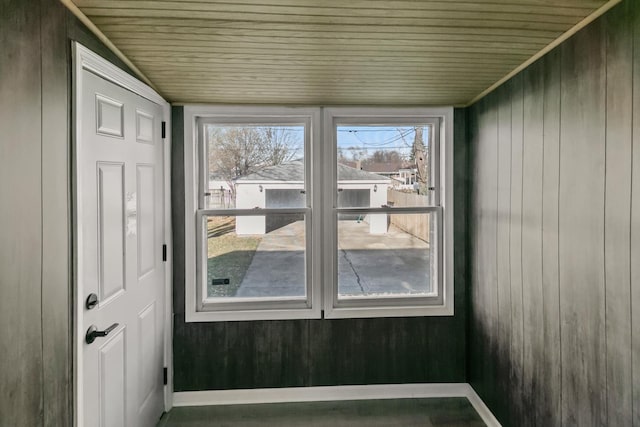 unfurnished sunroom with wood ceiling and vaulted ceiling