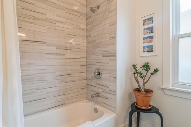 bathroom with shower / bath combo