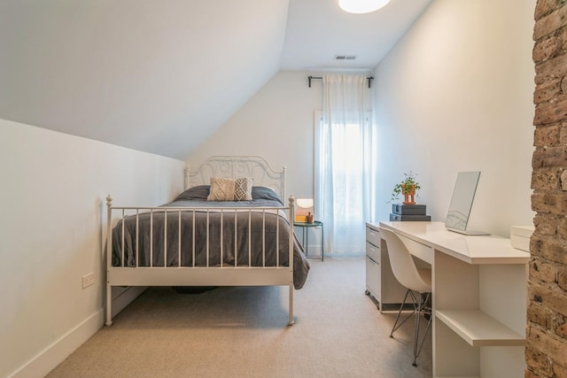 carpeted bedroom with vaulted ceiling