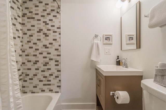 full bathroom with vanity, toilet, and shower / tub combo with curtain