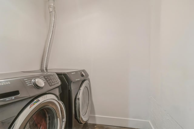 laundry room with independent washer and dryer