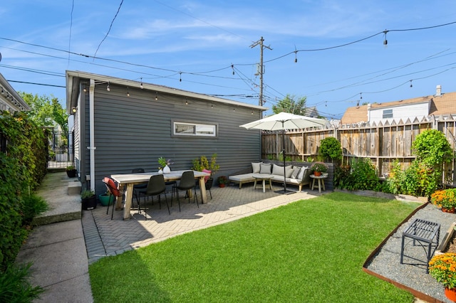 view of yard with an outdoor living space and a patio area