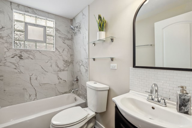 full bathroom with vanity, decorative backsplash, toilet, and tiled shower / bath combo