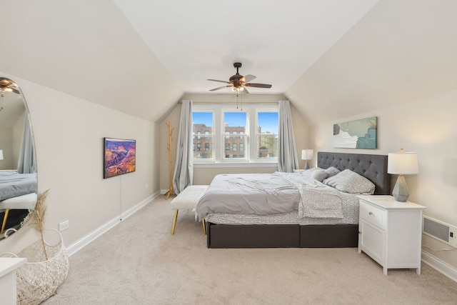 carpeted bedroom featuring vaulted ceiling and ceiling fan