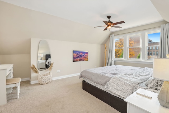 carpeted bedroom with ceiling fan and lofted ceiling