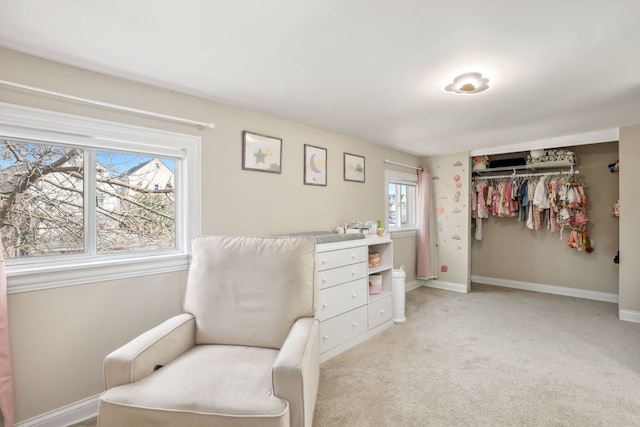 sitting room with light colored carpet