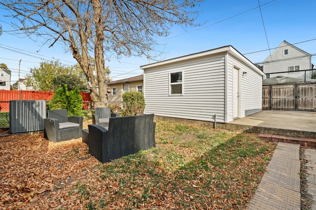 view of property exterior with a patio area