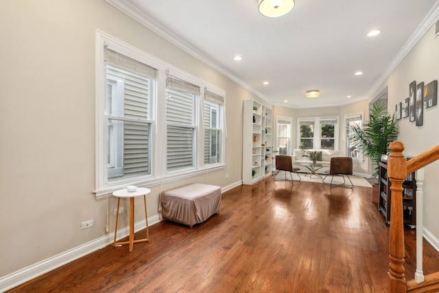 sitting room featuring hardwood / wood-style flooring and ornamental molding