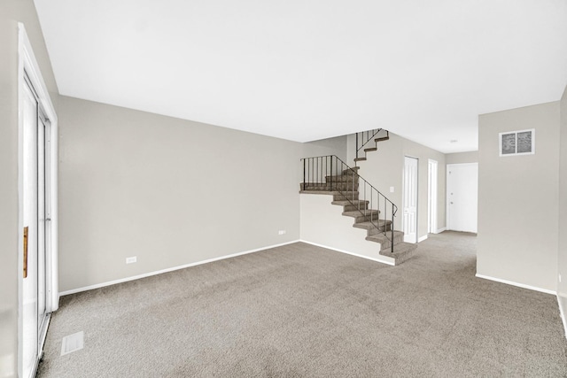 unfurnished living room with carpet