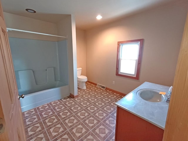 full bathroom featuring vanity, toilet, and tub / shower combination