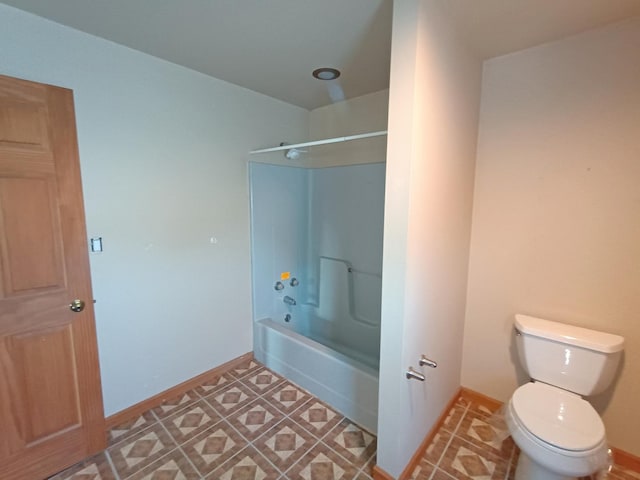 bathroom with toilet and shower / washtub combination