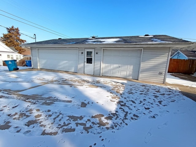 view of snow covered garage