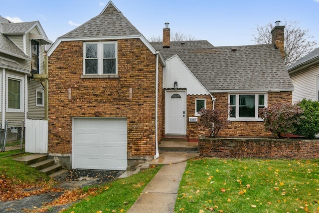 view of front of house featuring a garage and a front yard