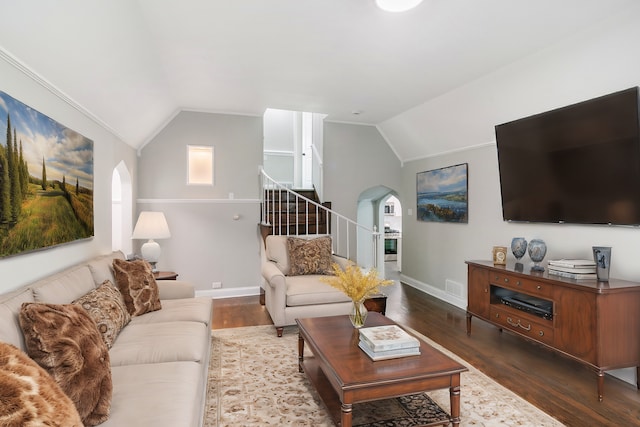 living room featuring crown molding, lofted ceiling, and dark wood-type flooring