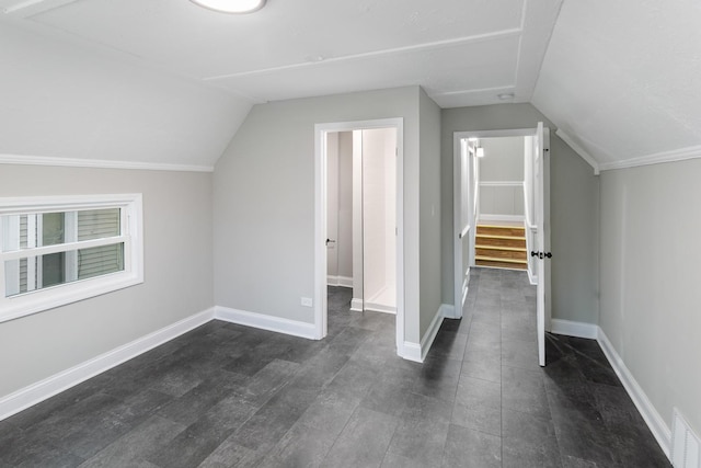 additional living space with vaulted ceiling