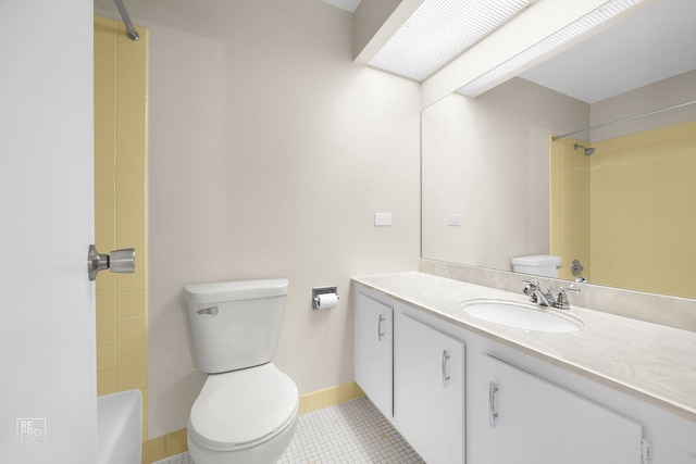 bathroom featuring tile patterned flooring, vanity, and toilet