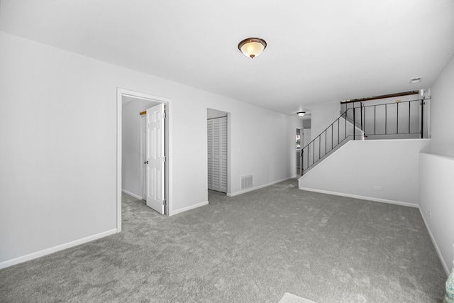 unfurnished living room with carpet floors