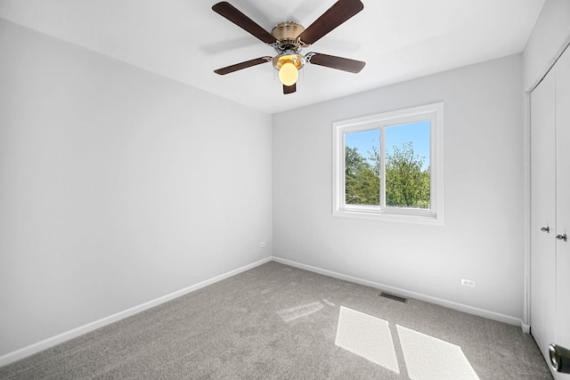 unfurnished room featuring carpet flooring and ceiling fan