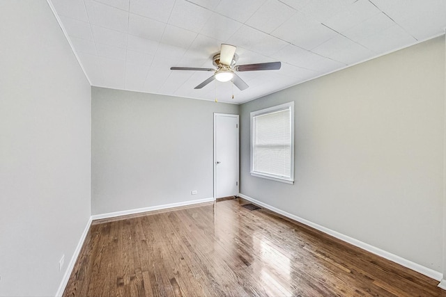 spare room with wood-type flooring