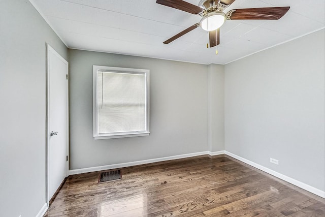 empty room with ceiling fan and wood-type flooring