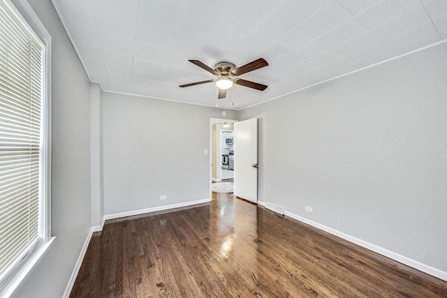 interior space with ceiling fan and dark hardwood / wood-style floors