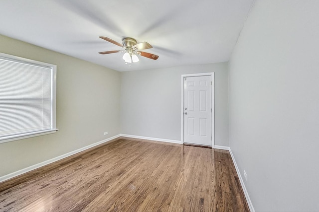 empty room with wood-type flooring and ceiling fan