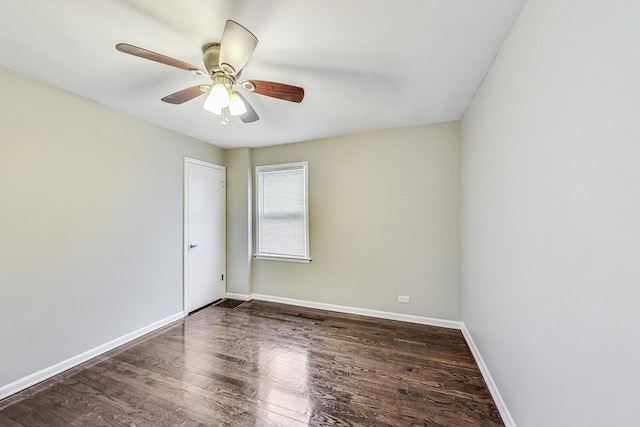 unfurnished room with dark hardwood / wood-style flooring and ceiling fan