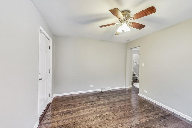 unfurnished room featuring dark hardwood / wood-style floors and ceiling fan