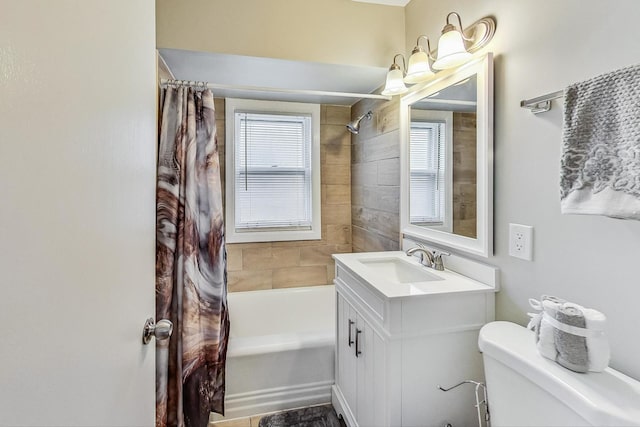 full bathroom with shower / tub combo, vanity, and toilet