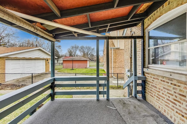 view of patio / terrace featuring an outbuilding and a garage