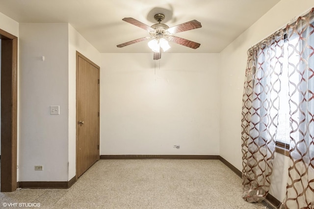 empty room with ceiling fan and light colored carpet