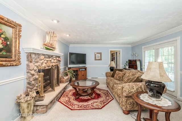 living room with a stone fireplace, crown molding, and carpet