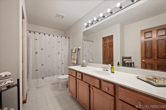 bathroom with vanity, visible vents, shower / tub combo, tile patterned floors, and toilet