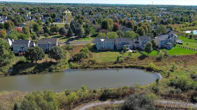 drone / aerial view featuring a residential view and a water view