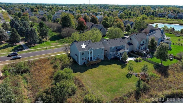 birds eye view of property featuring a residential view and a water view