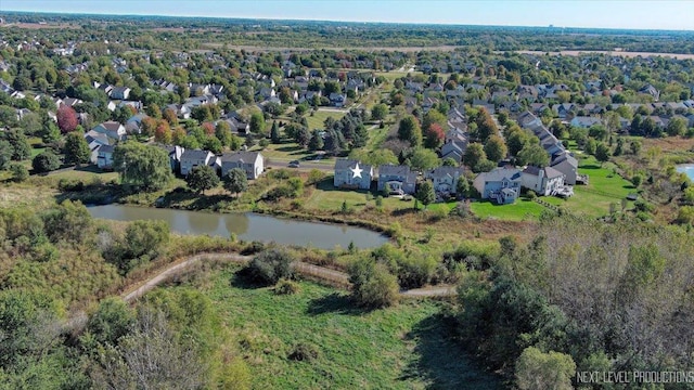 bird's eye view with a residential view and a water view