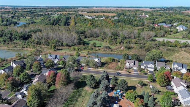 aerial view with a residential view, a water view, and a wooded view