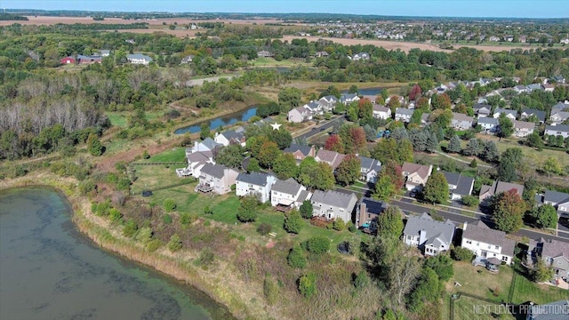 aerial view featuring a residential view and a water view