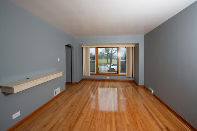 unfurnished room featuring light wood-type flooring