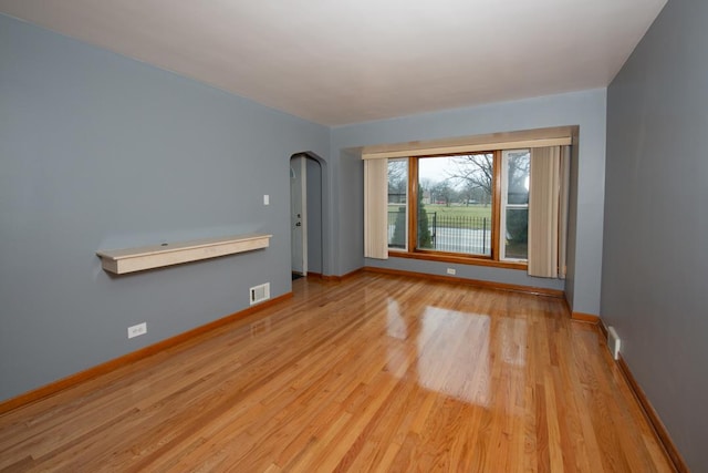 spare room featuring light hardwood / wood-style flooring