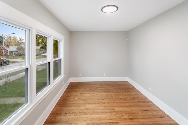 unfurnished room featuring light wood-type flooring