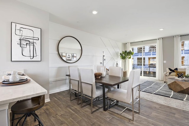 dining space featuring dark hardwood / wood-style flooring