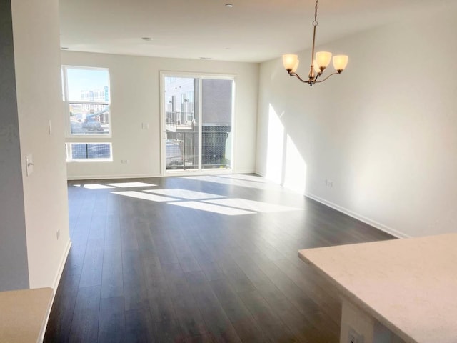 interior space featuring dark hardwood / wood-style floors and a notable chandelier