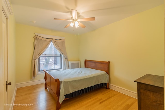 bedroom featuring light wood-type flooring and ceiling fan