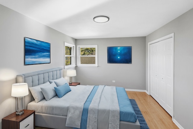 bedroom featuring light hardwood / wood-style floors and a closet