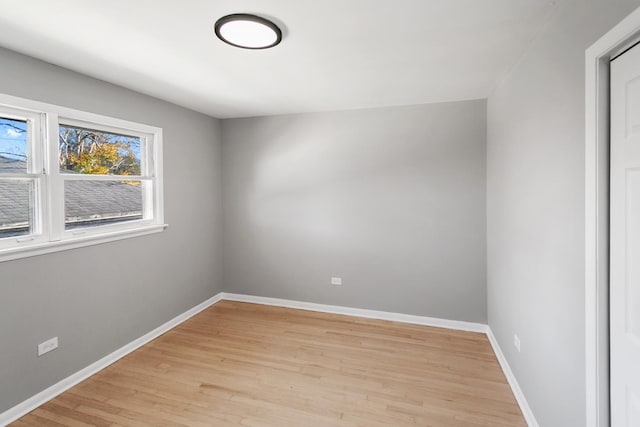 empty room with light hardwood / wood-style floors