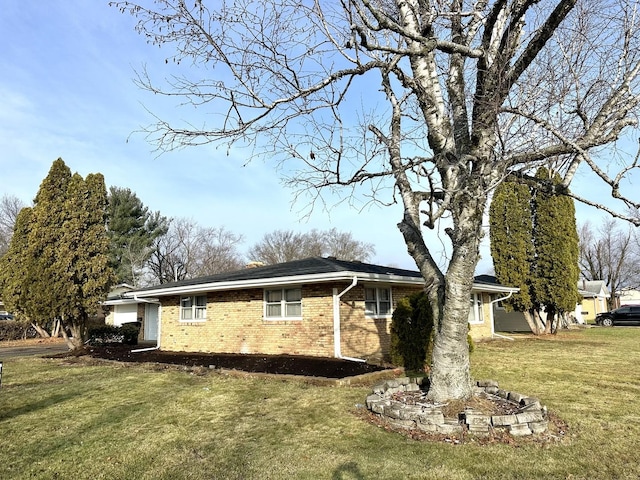 view of side of property with a yard