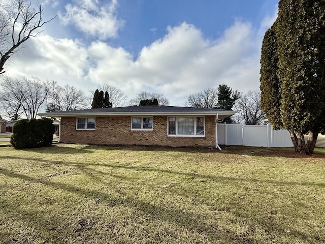 rear view of house with a yard