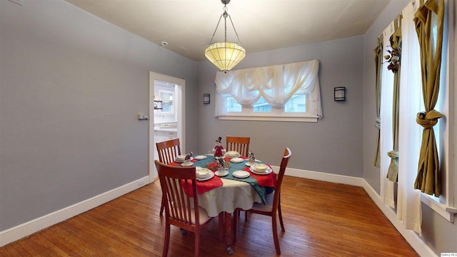 dining area with hardwood / wood-style flooring